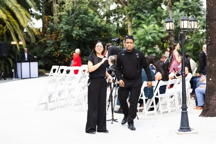 Justo and Maria Peña walking the venue before a ceremony