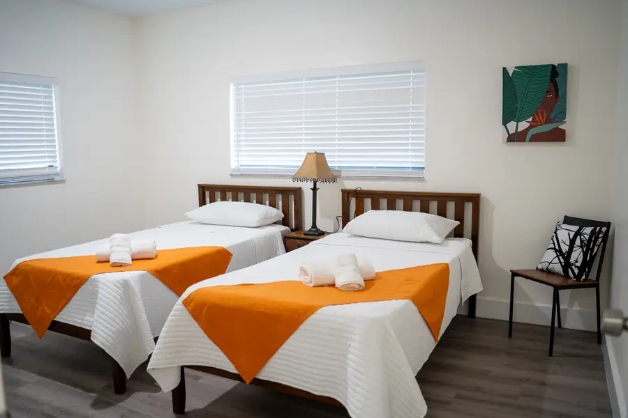 Twin bedroom set up for a family stay