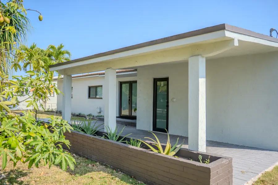 Modern exterior with covered patio and landscaping