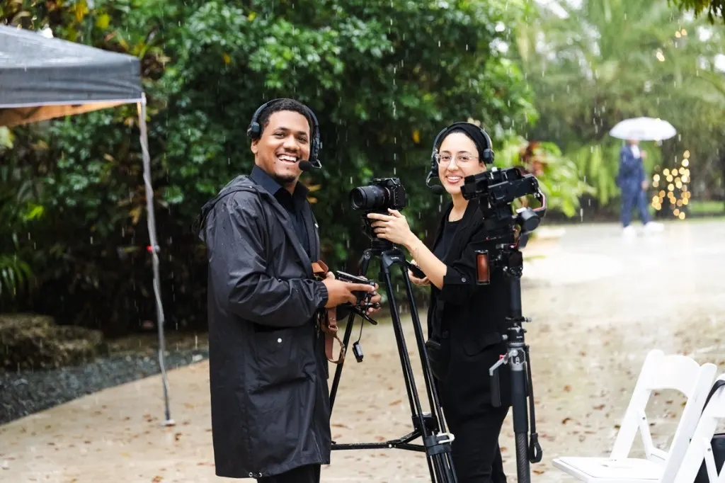 Solfilms team filming in the rain with headsets and professional cameras